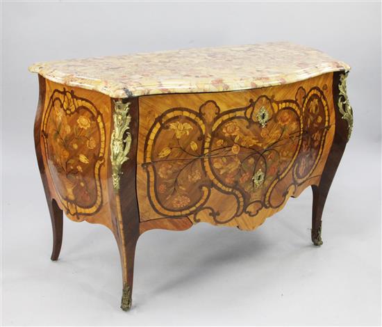 A Louis XV style fruitwood and ebony inlaid kingwood, tulipwood and marquetry commode, in the manner of Latz, W.4ft 1.5in. H.2ft 9in.